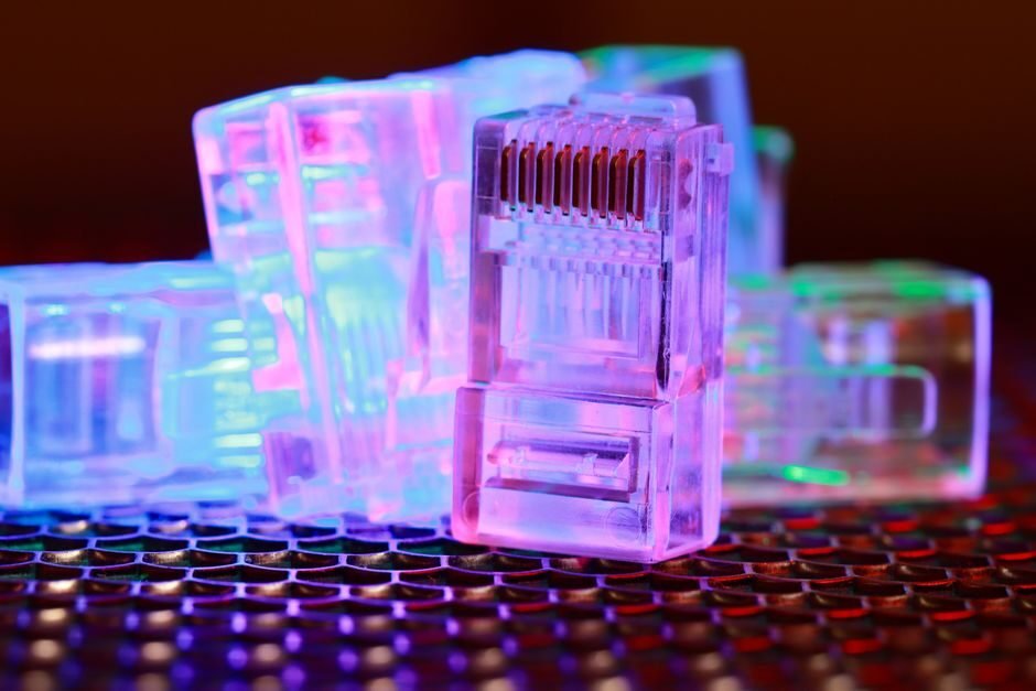 Close-up of an illuminated network cable connector