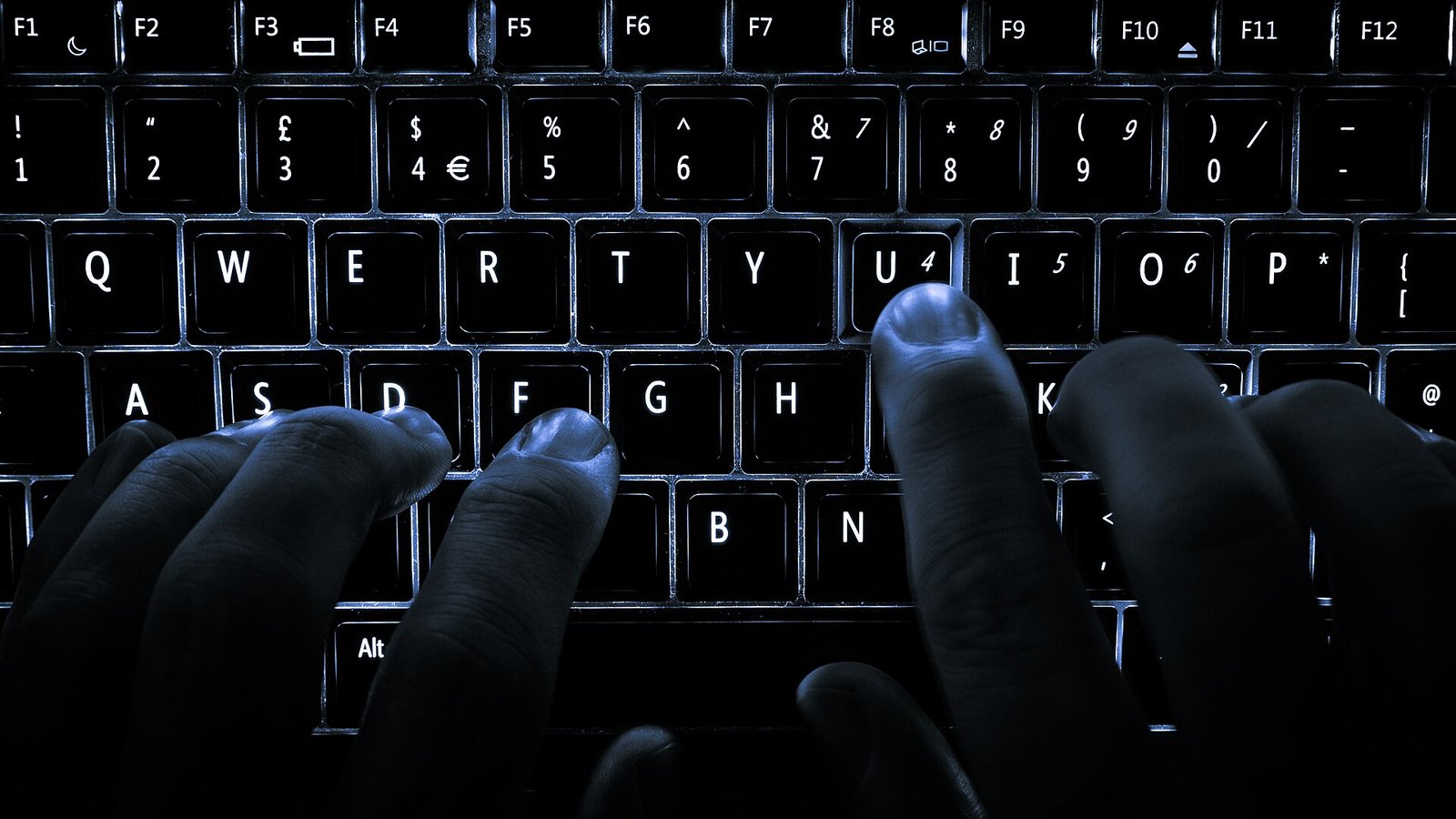 Person checking network speed checker results on a laptop screen