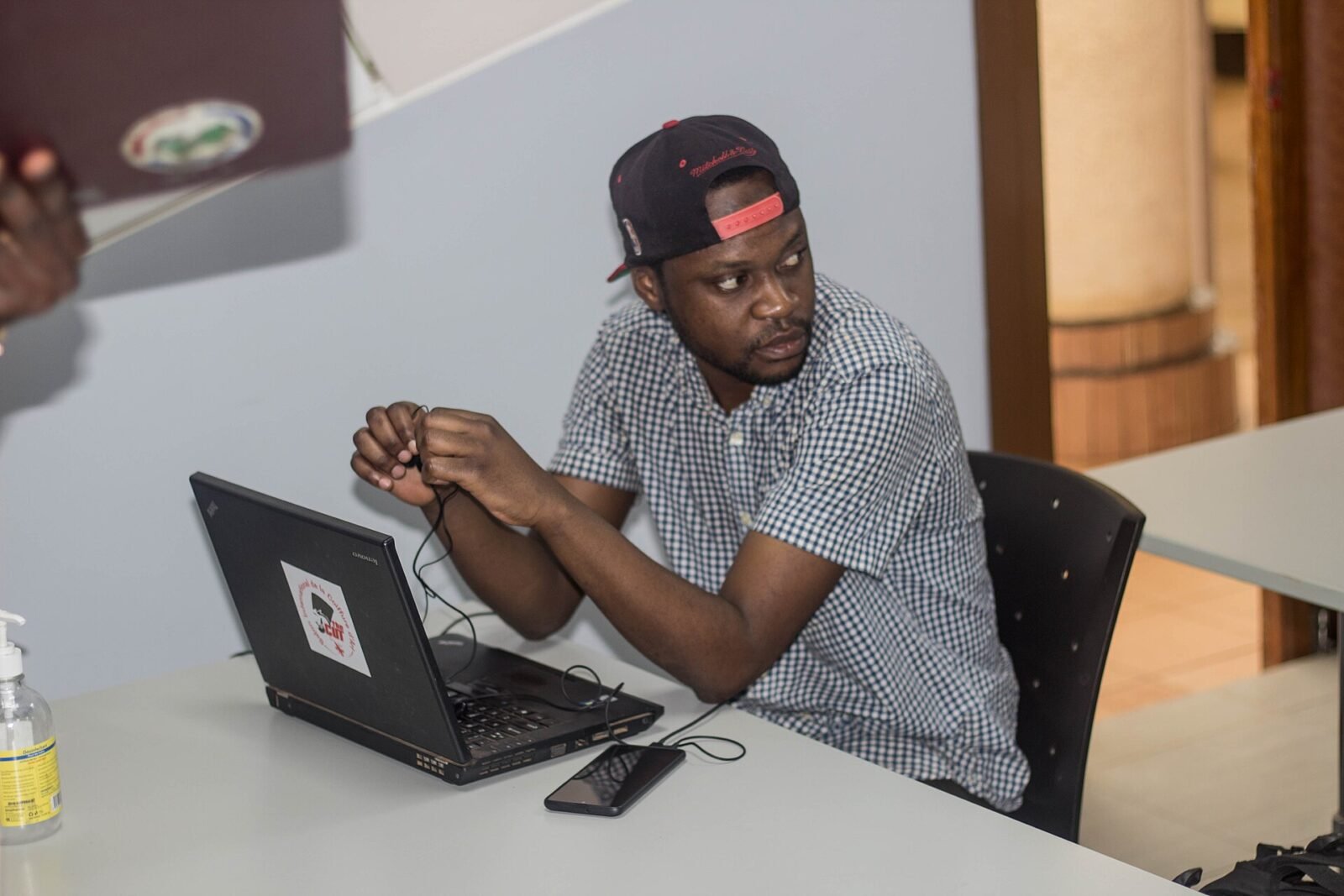 Person testing a WiFi connection on a laptop at home