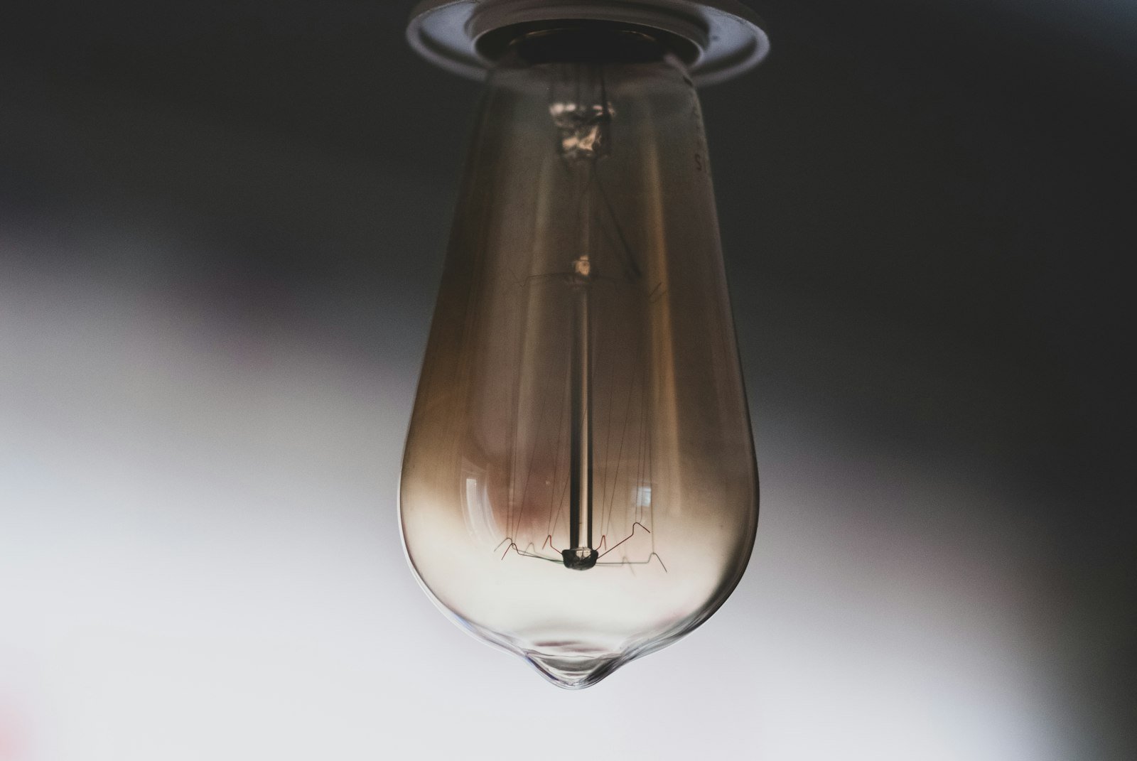 LED light bulb hanging from a ceiling used to transmit Li-Fi technology data