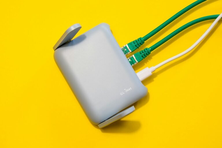 Wi-Fi router with cables plugged in, representing a mesh Wi-Fi system