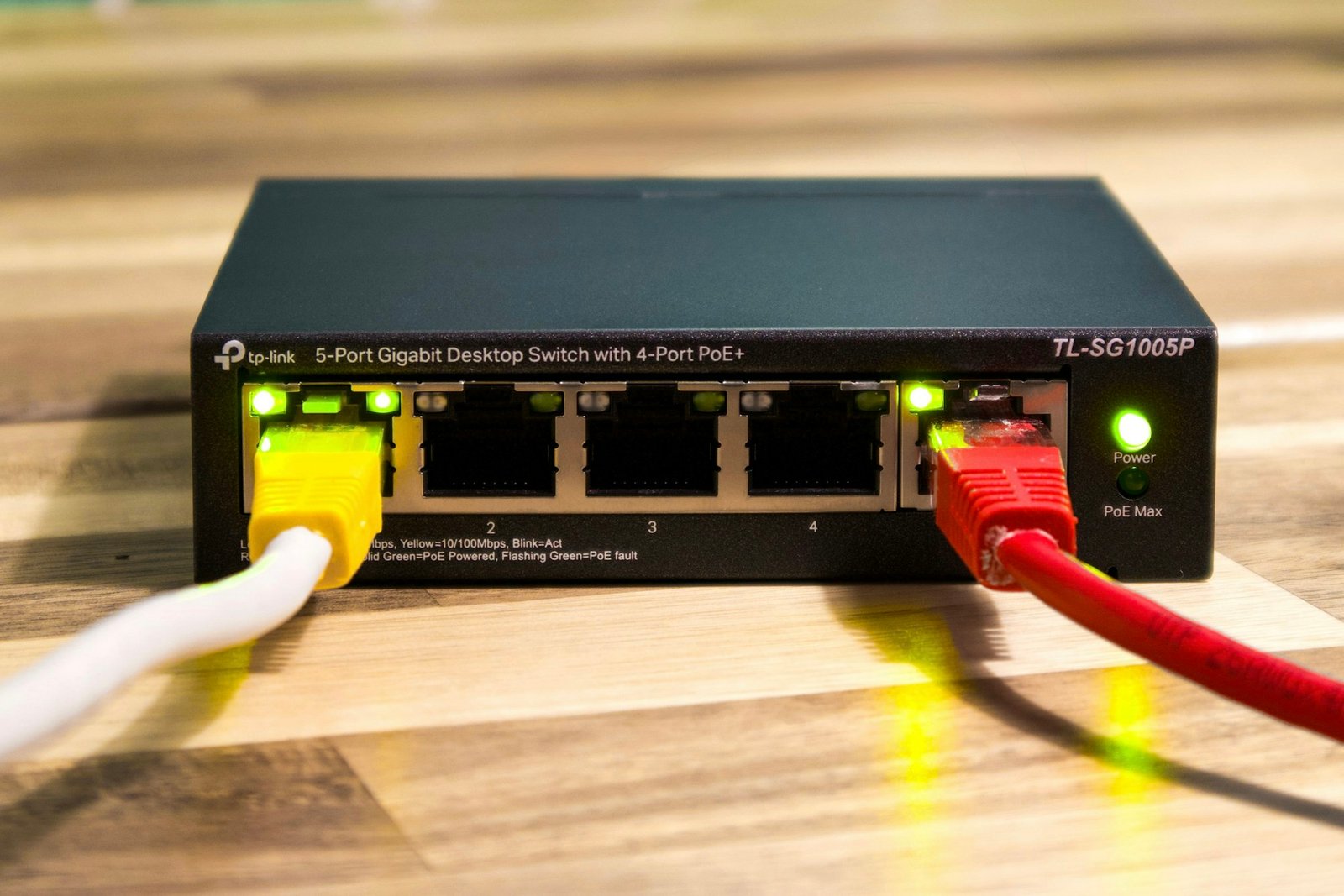 Network switch with ethernet cables connected, part of a home network an AI router manages