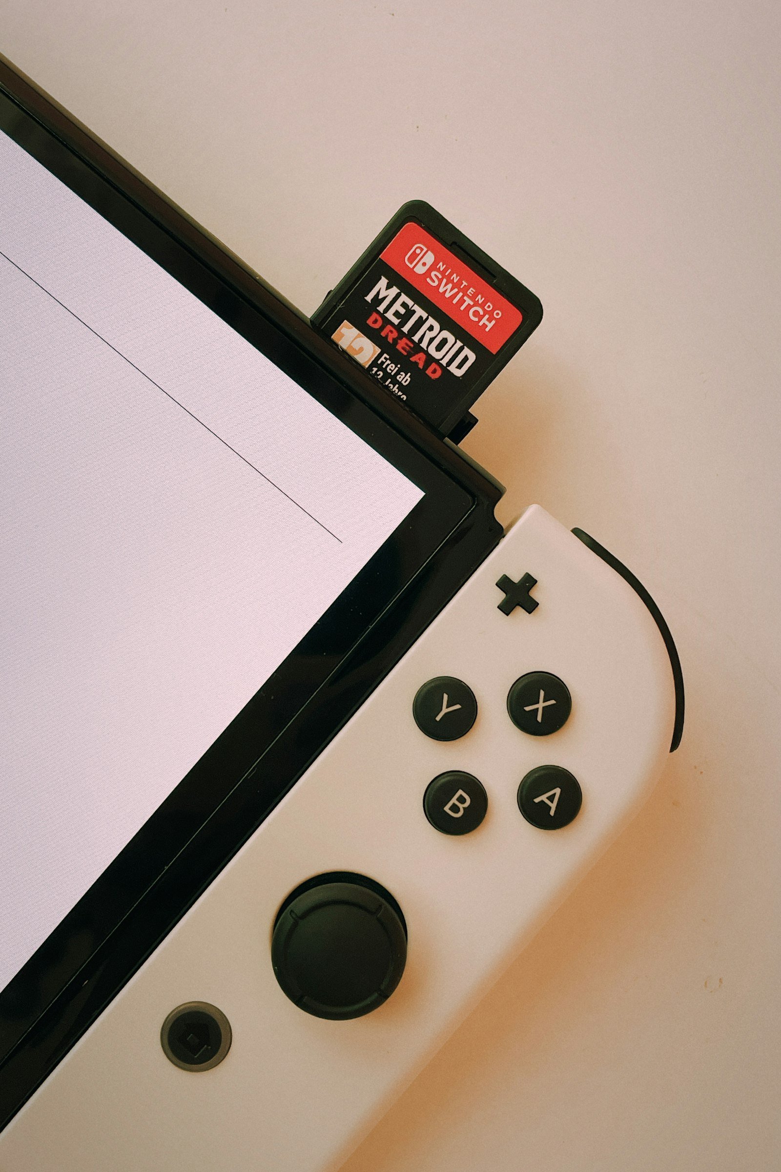 Game controller next to a computer monitor, showing online gaming lag caused by long queues
