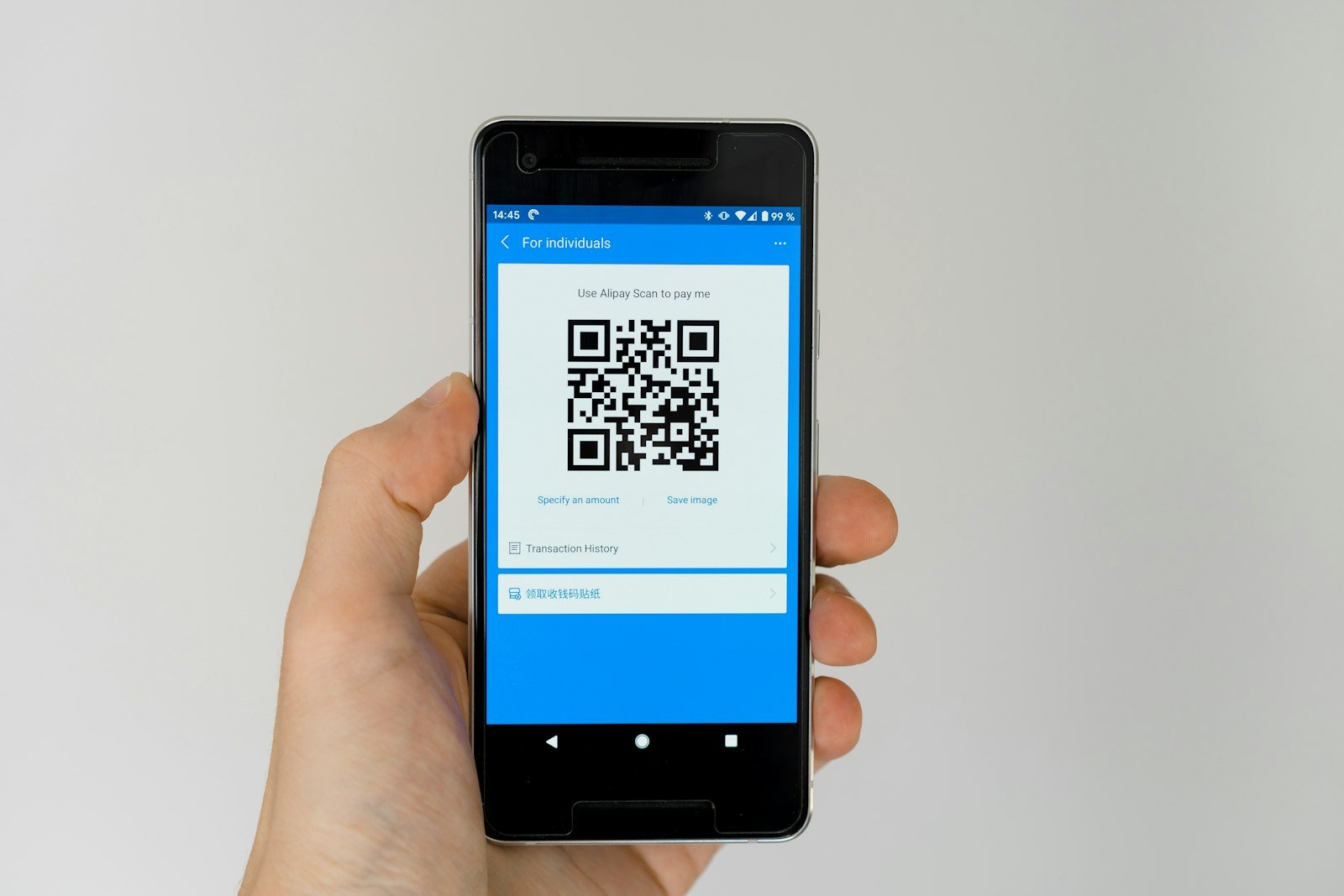 Android smartphone displaying a QR code used to activate an eSIM plan